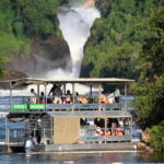 boat cruising in Murchison Falls National Park along the Nile river