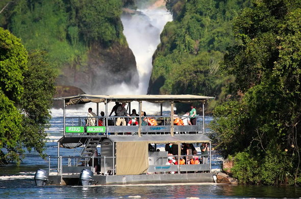boat cruising in Murchison Falls National Park along the Nile river